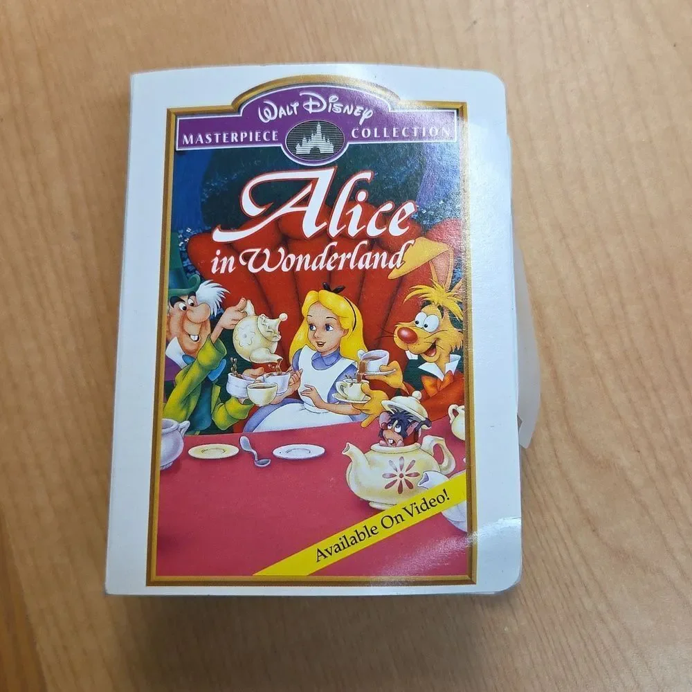 Alice in Wonderland 1 vhs 1 dvd movie, 1 book, Happy‎ Meal Toy, Stickers, Pin